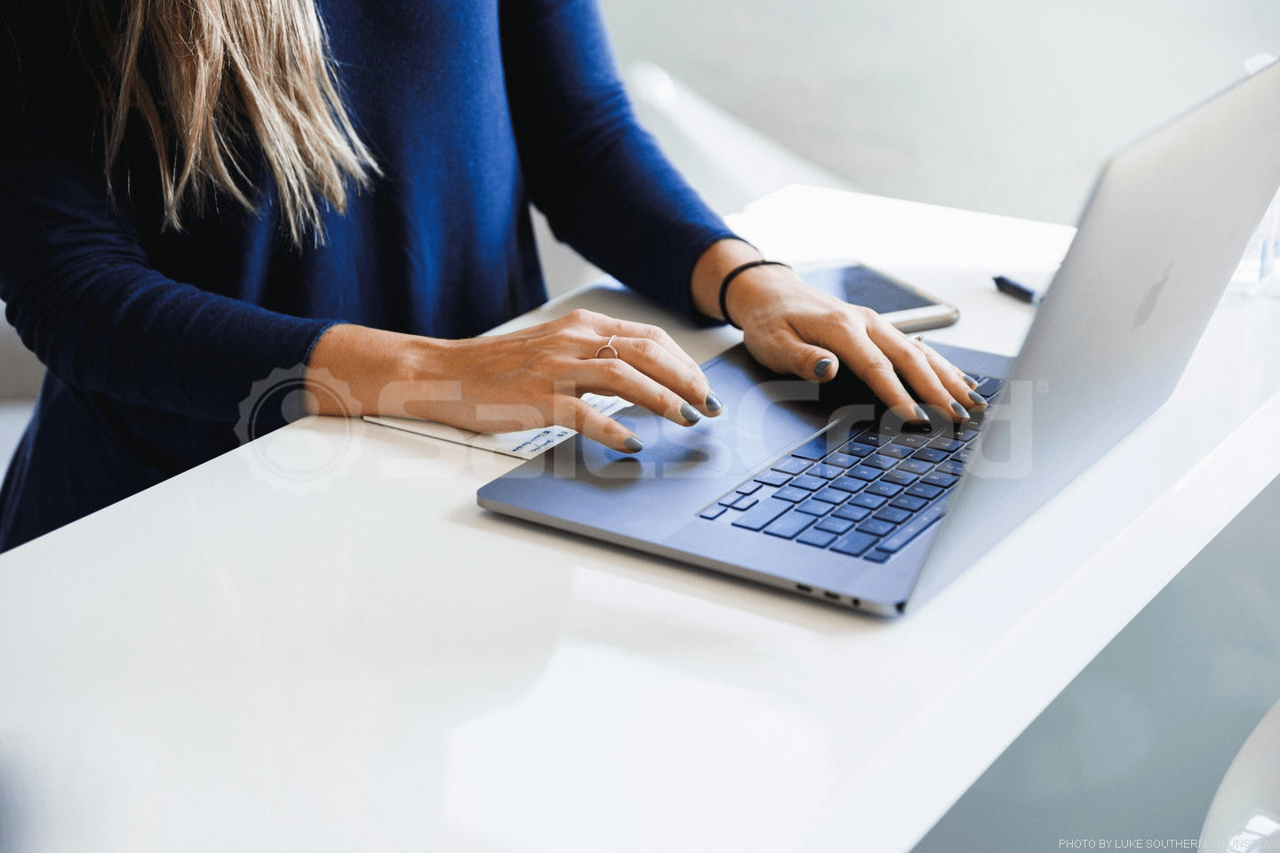 woman typing on laptop