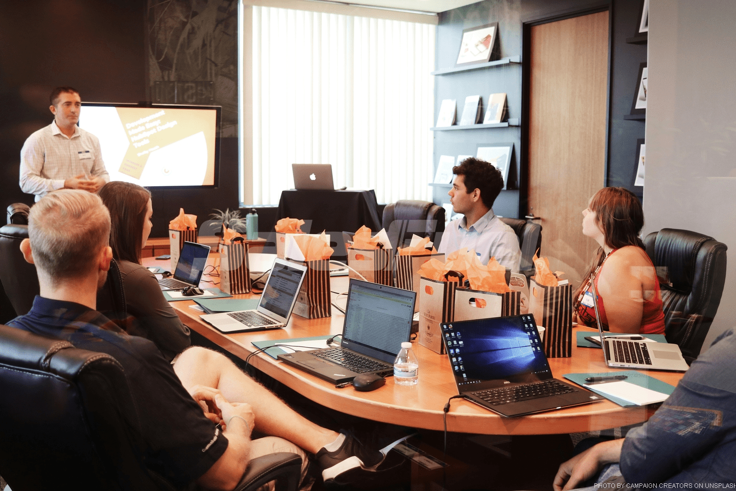 man presenting to group