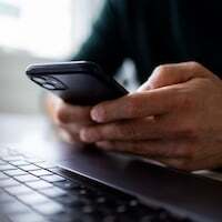 Focus on man hands typing message