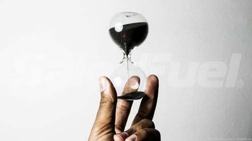 hand holding hourglass